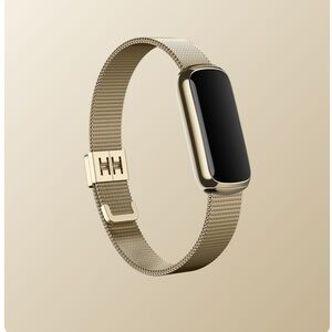 FITBIT LUXE with gold band, lunar white band, and charger
